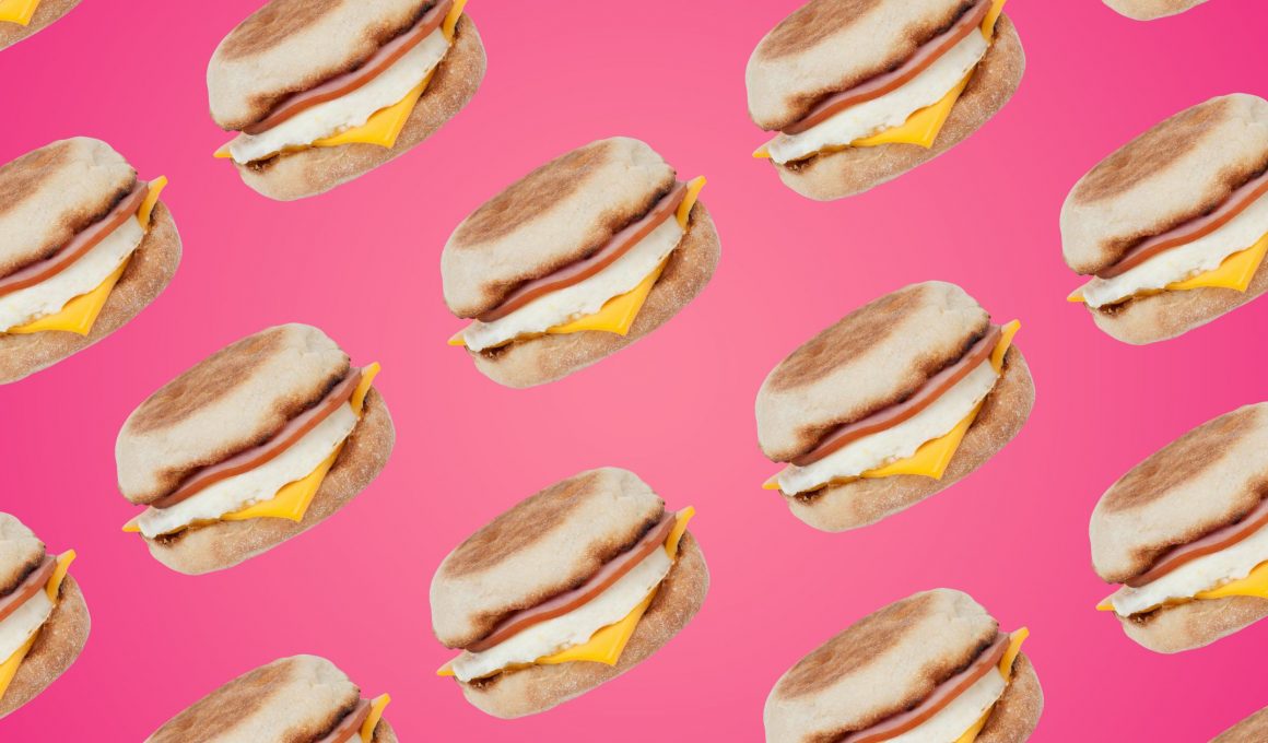 pattern of mcdonald's egg mcmuffin sandwiches on pink background