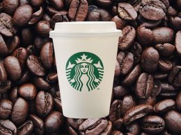 starbucks cups on a background of coffee beans