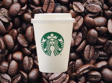 starbucks cups on a background of coffee beans