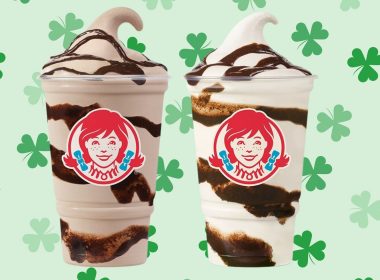 two wendy's frosty cups on a green shamrock background