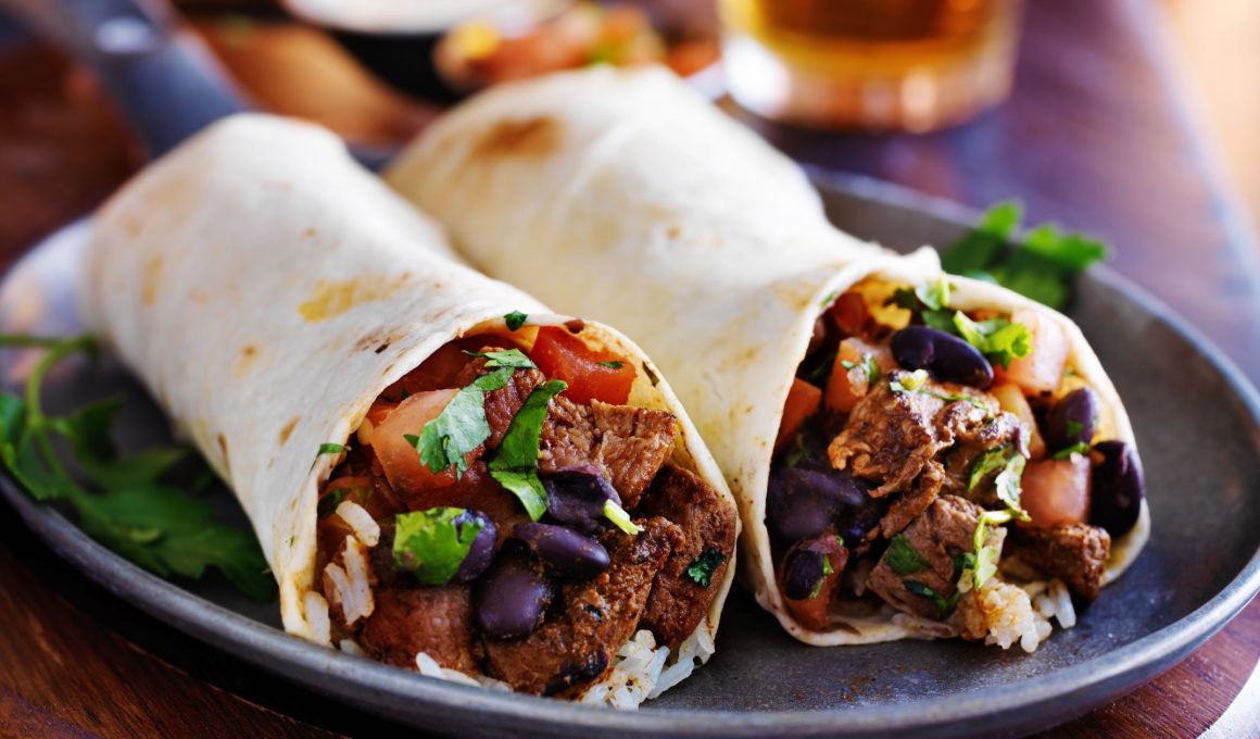 two burritos on a blue plate
