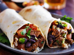 two burritos on a blue plate