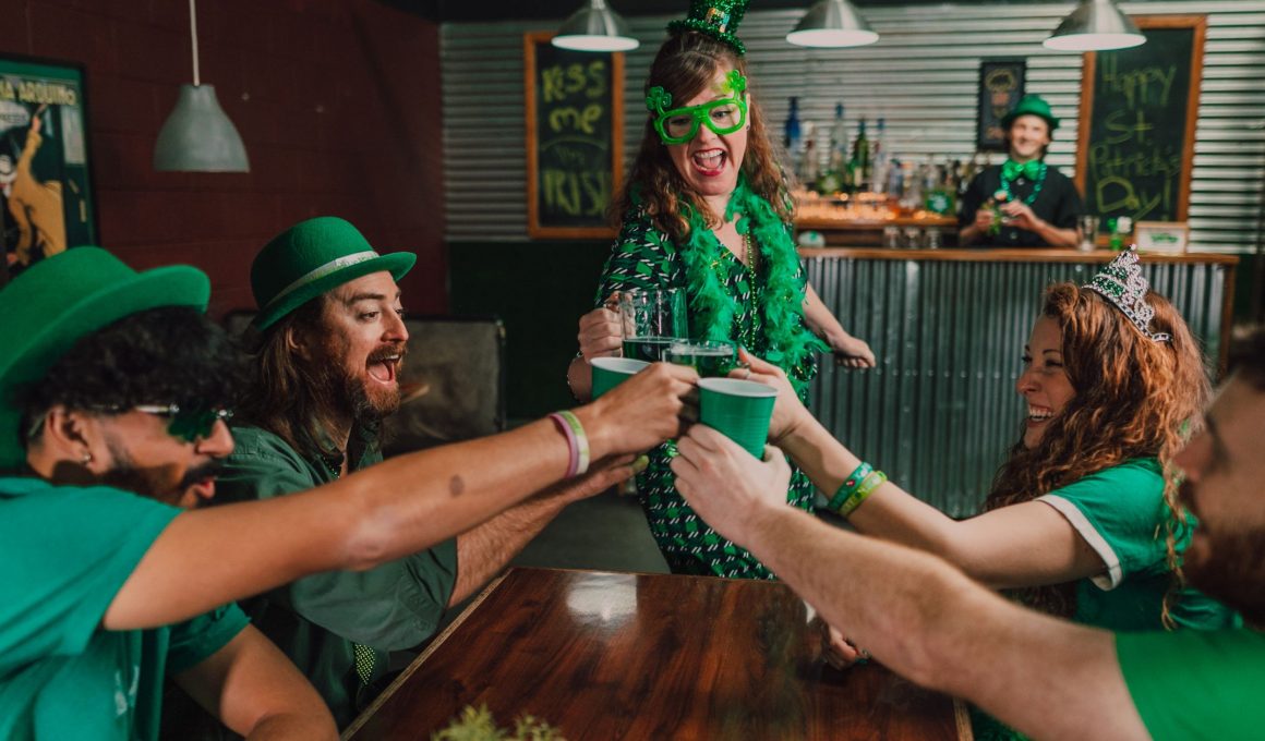 group of people wearing green celebrating st patrick's day
