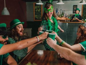 group of people wearing green celebrating st patrick's day