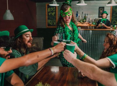 group of people wearing green celebrating st patrick's day