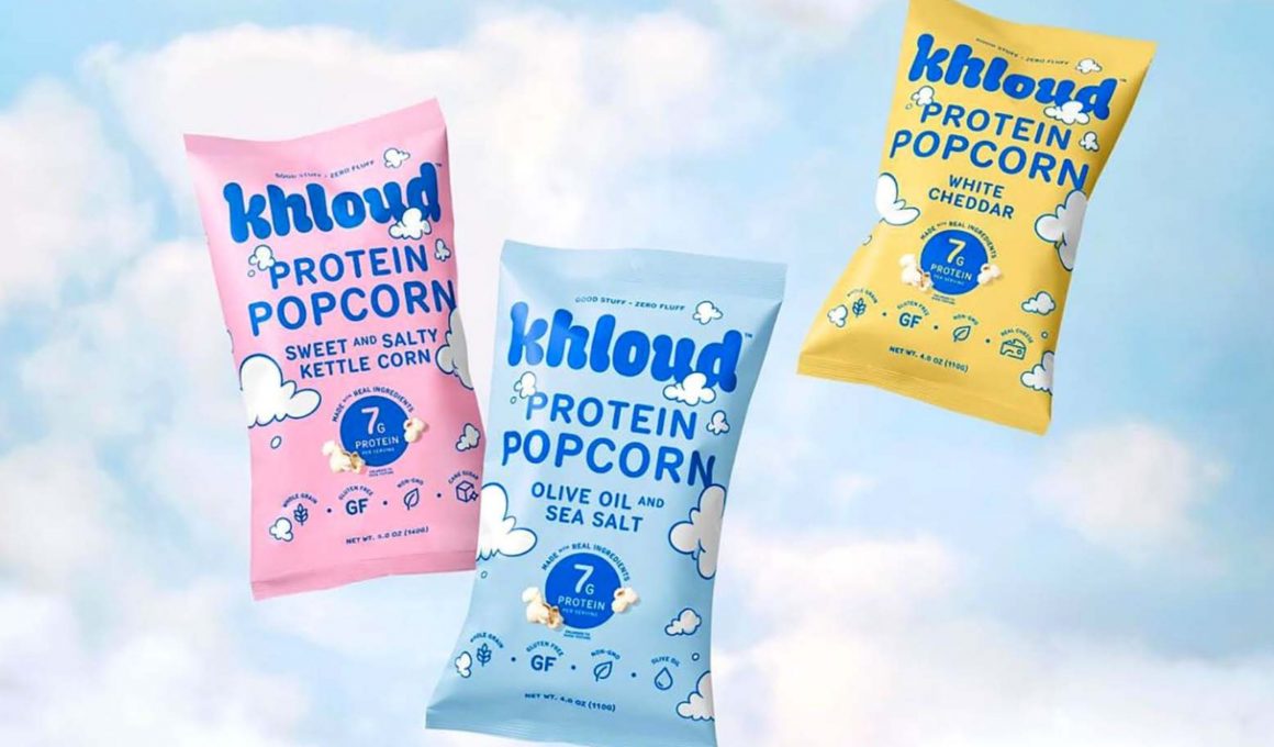 bags of khloud protein popcorn on a blue background with white clouds